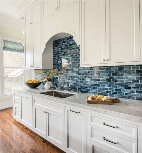 white backsplash with blue accents.